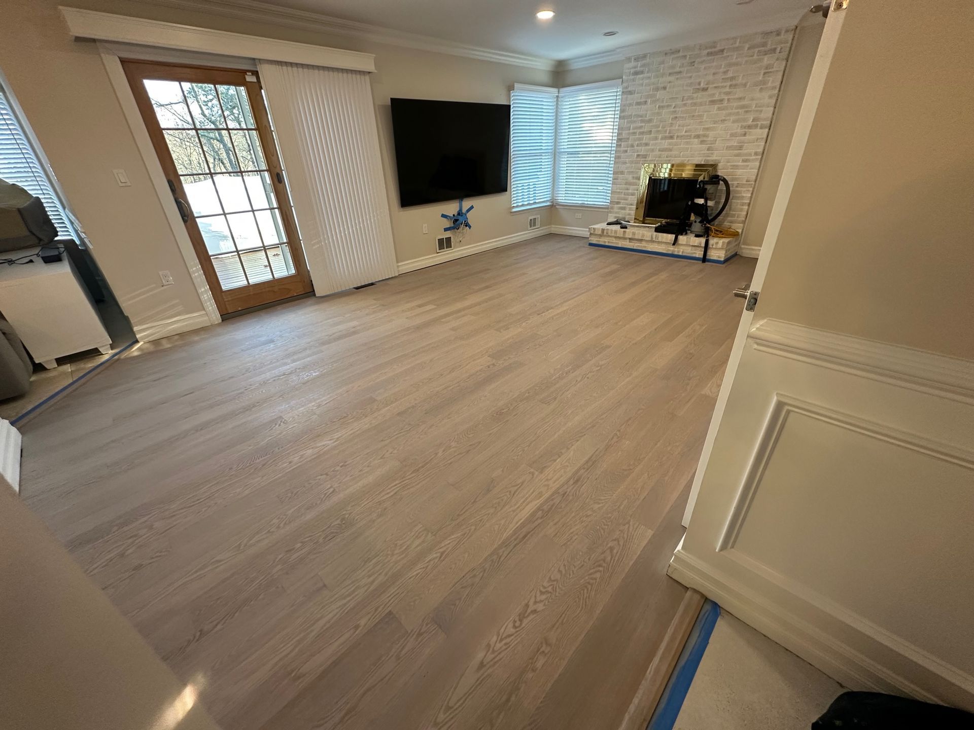 A Living Room And Dining Area With Newly Installed Or Refinished Red Oak Hardwood Floors With A Natural Finish.